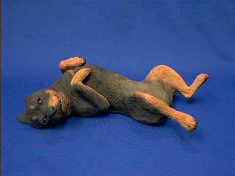 rottweiler figurine sandicast on back
