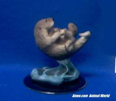 sea otter figurine pair mom and baby