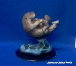 sea otter figurine pair mom and baby